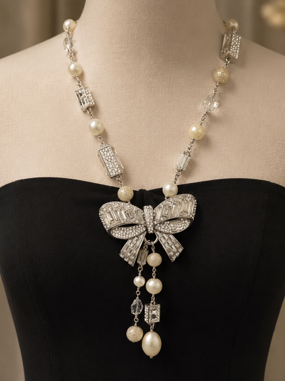 CHANEL Silver-Tone Crystal Bow Necklace with Ivory Accents